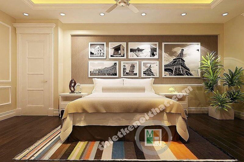 Bức tường được trang trí với mẫu tranh canvas treo tường ấn tượng cho phòng ngủ